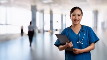 Nurse with clipboard compliance with CQC NICE & procurment regulations