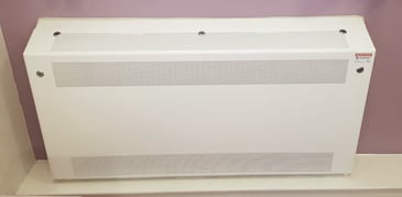 An anti ligature radiator cover in a low security mental health unit